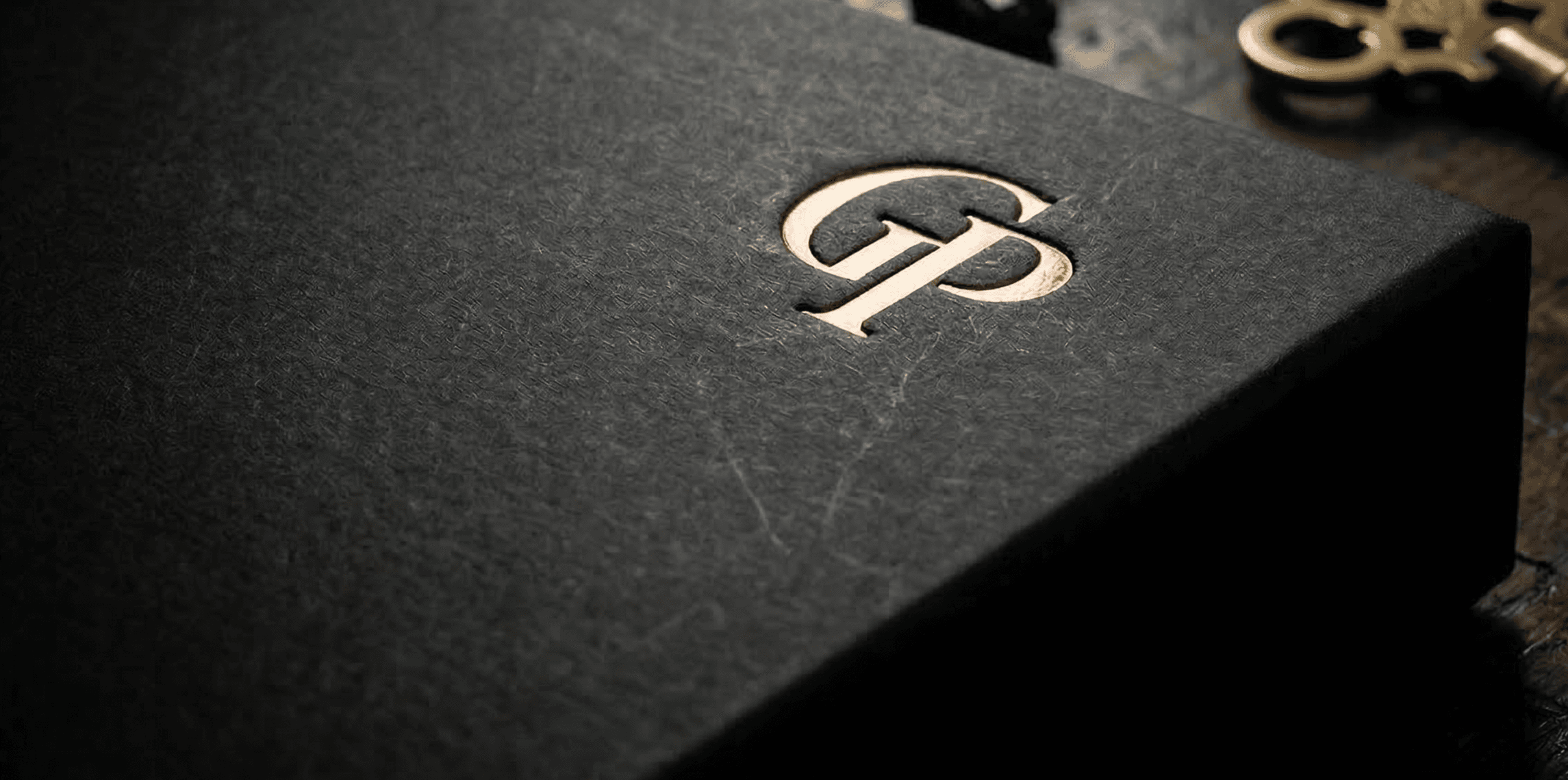 Black rigid presentation box hot foil stamped.