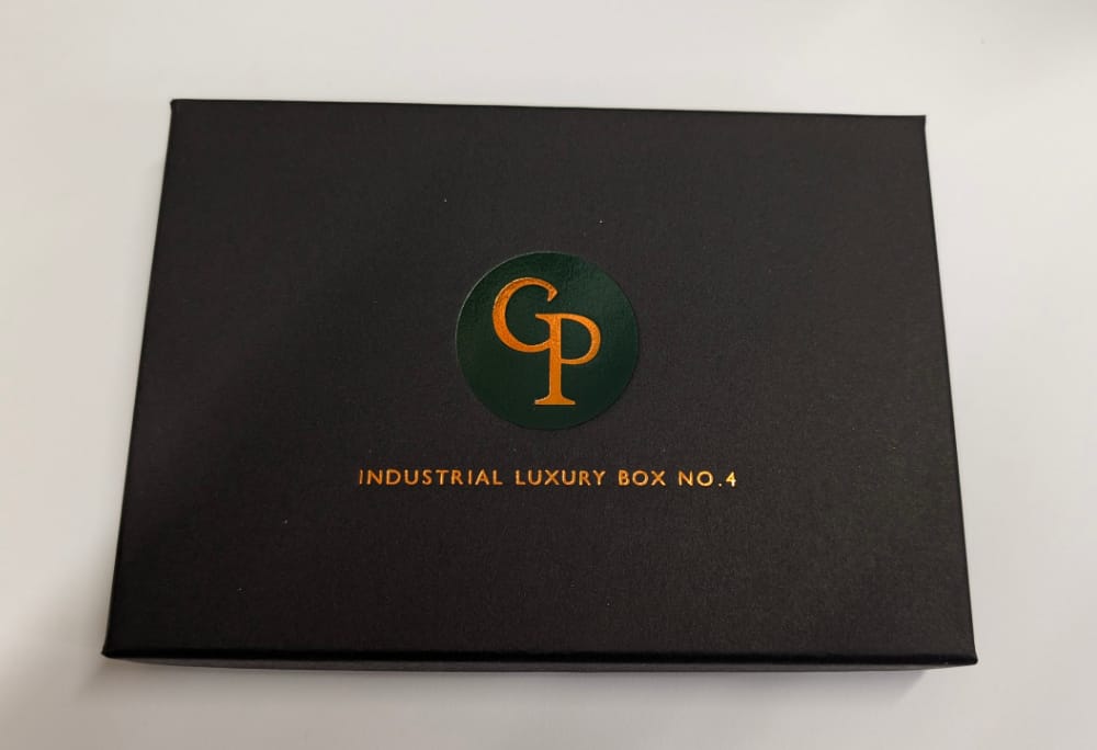 Firebrand Box No.7 sample kit showing deep impression hot foil stamping on 1200gsm black cardstock